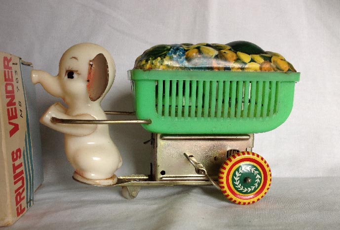 vintage boxed Chinese tinplate and plastic clock work wind up MS783 elephant Fruits Vender toy